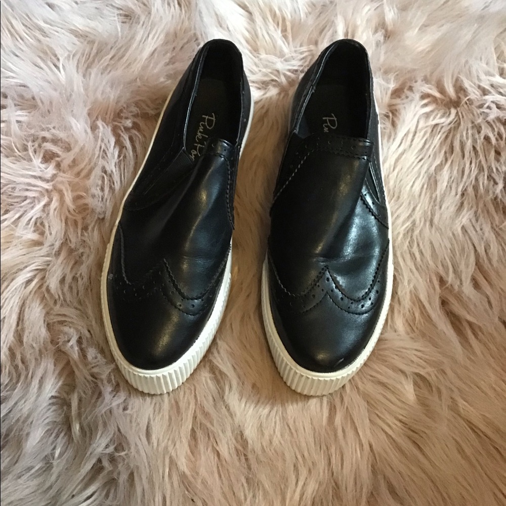 Black Oxford like tennis shoes.